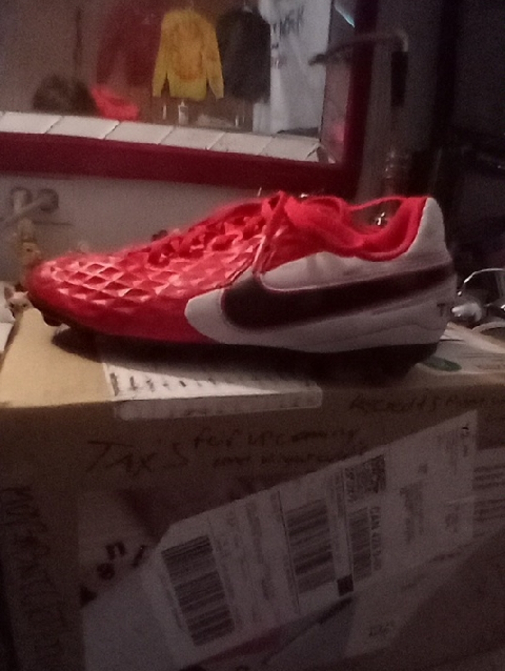 Nike Red Soccer Cleat with White and Black Accents